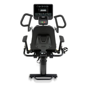 The Spirit Fitness CRS800S Recumbent Seated Stepper by Spirit Fitness is a black exercise bike seen from the rear, featuring a large digital display screen, side handles, a cushioned seat with backrest, and pedal straps.