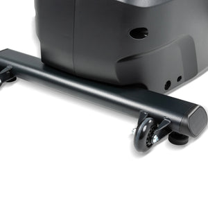 Close-up of the base of the Spirit Fitness CRS800S Recumbent Seated Stepper, showing two small transport wheels for easy movement and stability.