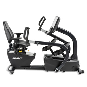 The Spirit Fitness CRS800S Recumbent Seated Stepper by Spirit Fitness is a black exercise machine with a padded seat, backrest, and handles. It features foot pedals, a digital console for workout tracking, and displays the brand name on its side.