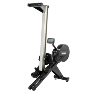 The Spirit Fitness CRW800 Rower by Spirit Fitness is a black and silver rowing machine featuring a digital display, flywheel housing, and footrests, shown upright for storage against a white background.