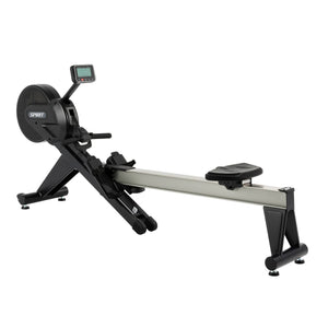 The Spirit Fitness CRW800 Rower by Spirit Fitness is shown on a white background, featuring a black and silver design with a digital monitor, sliding seat, and footrests.
