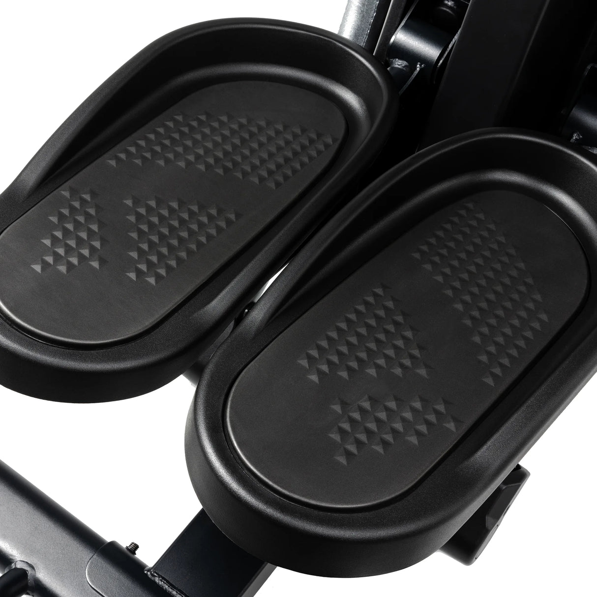 Close-up of the black, textured foot pedals on the Spirit Fitness CS800 Stepper by Spirit Fitness.