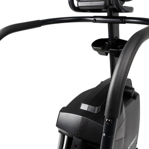 Close-up view of the Spirit Fitness CS800 Stepper’s black handlebars, console mount, and water bottle holder, showing part of the frame and control panel area against a white background. Brand: Spirit Fitness.