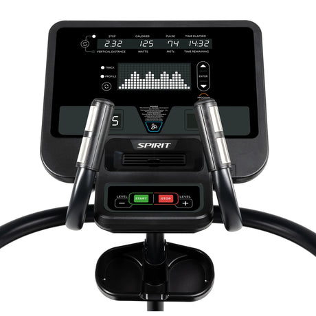 Close-up of the Spirit Fitness CS800 Stepper console by Spirit Fitness, showing workout data like steps, calories, pulse, and time. Control buttons for start, stop, level adjustment, and handlebars are visible in the foreground.