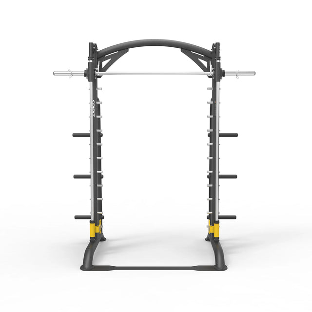 Front view of the Spirit Fitness CSF-SMTH Smith Machine showing the counterbalanced bar, arched top rail, and yellow safety catches on the base.