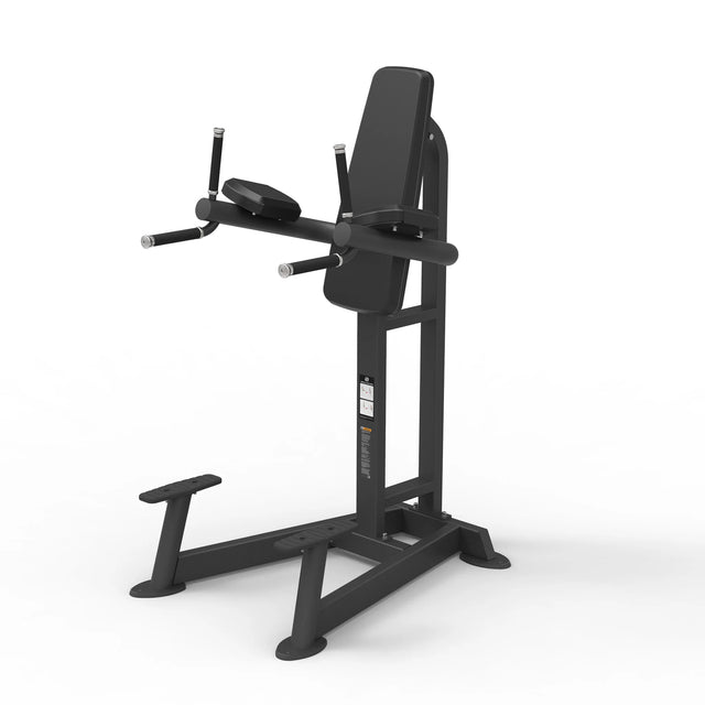 Angled view of the Spirit Fitness CSF-VKRD Vertical Knee Raise/Dip Station showing the back pad, forearm rests, dip handles, and step-up platform.