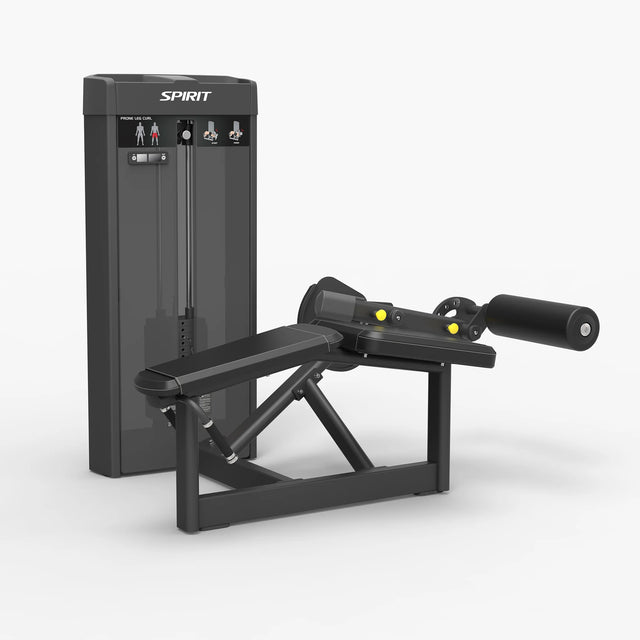Angled view of the Spirit Fitness CSS-PRLC Prone Leg Curl showing the weight stack, angled bench pad, and rear leg roller pad.