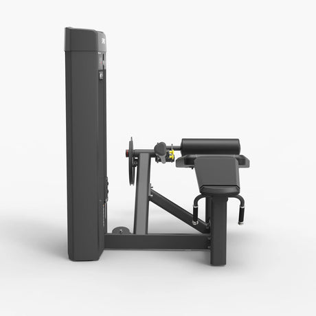 Side profile view of the Spirit Fitness CSS-PRLC Prone Leg Curl showing the bench pad, leg roller, and adjustment pin on the frame.
