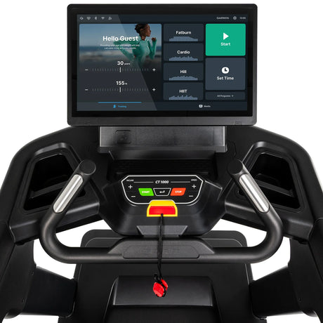 Close-up of the Spirit Fitness CT1000ENT Treadmill's touchscreen console displaying the Hello Guest home screen and workout program tiles.