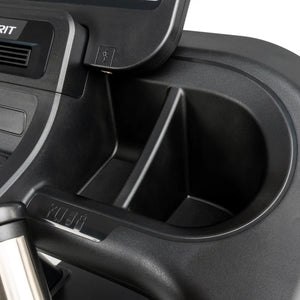 Close-up view of the Spirit Fitness CT800 Treadmill console by Spirit Fitness, showing a cup holder, small storage compartments, USB port, partial monitor, and control buttons.
