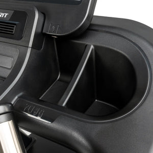 Close-up of the Spirit Fitness CT800ENT Treadmill console by Spirit Fitness, featuring a sleek black finish with a large cup holder, device storage compartment, and visible USB port on the upper edge.