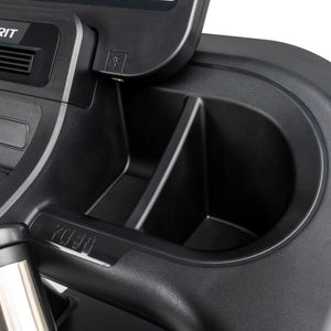 Close-up of the Spirit Fitness CT850 Treadmill console in black, with a round cup holder, accessory compartments, and control buttons positioned below the LCD display.