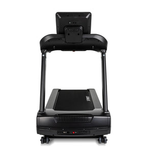 Spirit Fitness CT850ENT Treadmill by Spirit Fitness, featuring a touchscreen console, dual handrails, wide running belt, and transport wheels. Shown from the front against a white background.