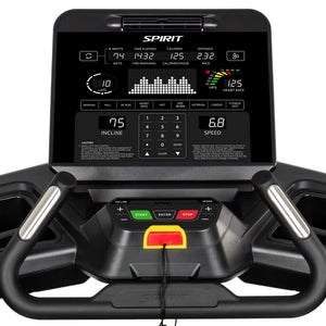 Close-up of the Spirit Fitness CT900 Treadmill control panel showing workout stats—time, calories, distance, speed, incline, METs, pulse, heart rate—and start, enter, and stop buttons below the display. Brand: Spirit Fitness.