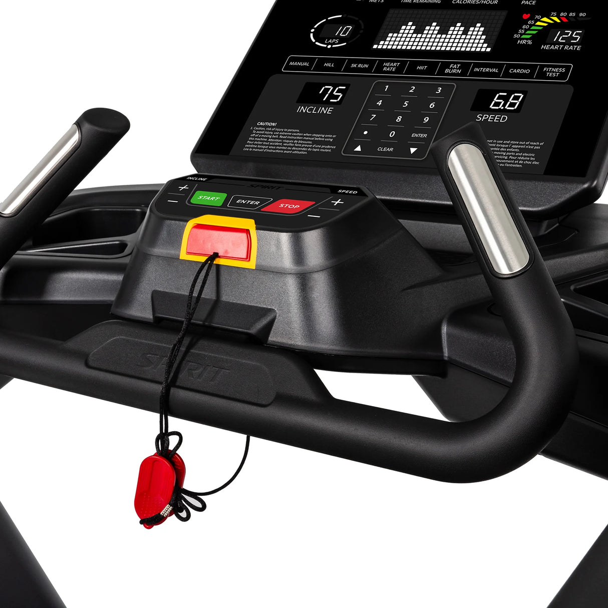 Close-up of the Spirit Fitness CT900 Treadmill’s black console with digital display for speed, incline, and heart rate. A red safety key is attached below green, red, and yellow control buttons. Brand: Spirit Fitness.