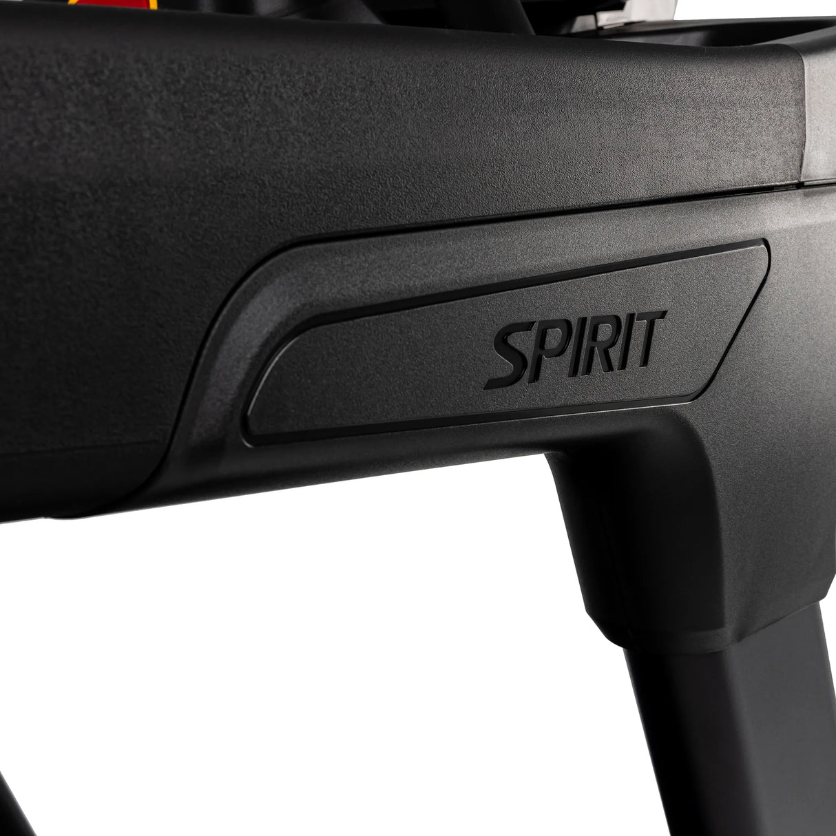 Close-up of the Spirit Fitness CT900 Treadmill's black frame, featuring the embossed Spirit Fitness logo. The white background highlights the branding detail.