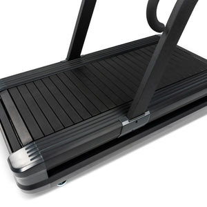 Close-up of the Spirit Fitness CTSBS900 curved slat belt and corner leveling foot.