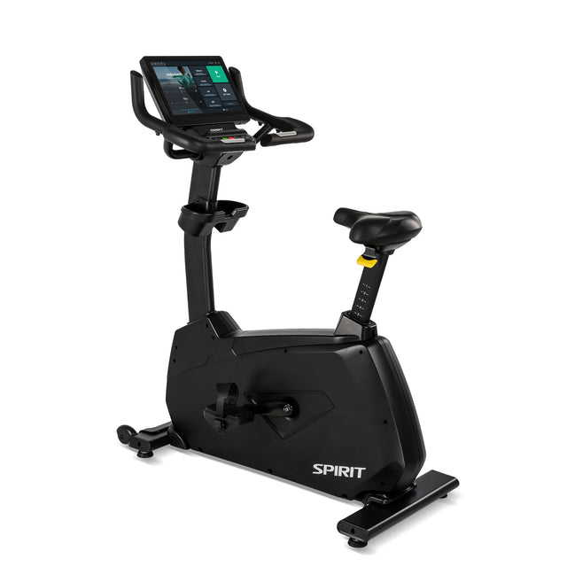 Front three-quarter view of the Spirit Fitness CU1000ENT Upright Bike showing the large touchscreen console displaying a workout menu, wide seat, water bottle holder, and pedal crank on a black frame, displayed on a white background.