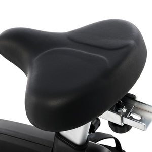 Close-up of the Spirit Fitness CU800 Upright Bike's black, wide, cushioned seat featuring a contoured surface and sturdy metal support bracket.