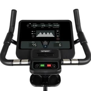 Close-up of the Spirit Fitness CU800 Upright Bike’s digital console displaying distance, calories, pulse, time, RPM, and resistance. The Spirit Fitness bike’s handlebars and start/stop/level controls are also shown.