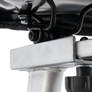 Close-up of bolts and welded joints under the Spirit Fitness CU800 Upright Bike, highlighting black and silver fasteners on its metal structure.