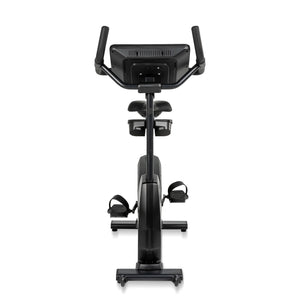 The Spirit Fitness CU800 Upright Bike by Spirit Fitness is shown from the front, highlighting its black modern design, handlebars, seat, pedals with straps, and digital display screen.