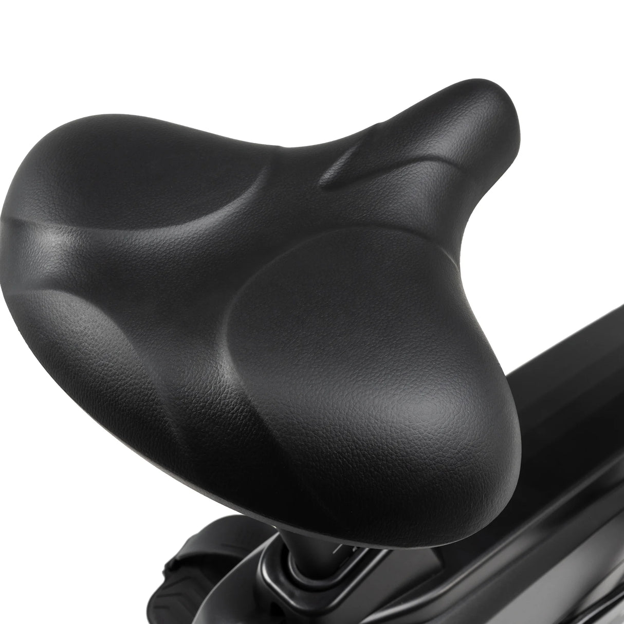Close-up of the Spirit Fitness CU900 Upright Bike’s black, ergonomically designed seat with smooth contours and matte finish, mounted on the frame against a white background.