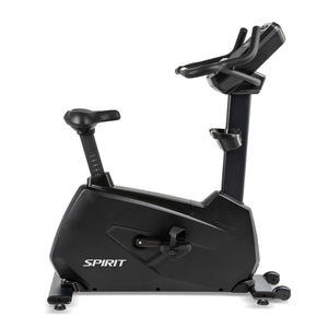 The Spirit Fitness CU900 Upright Bike features a black frame, padded seat, adjustable handlebars, and a display screen. The Spirit Fitness brand name appears on the bike’s base.