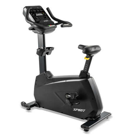 The Spirit Fitness CU900 Upright Bike is a black exercise bike with an electronic display, adjustable seat and pedals, featuring the Spirit Fitness brand name on its base.