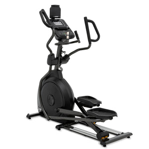 The Spirit Fitness XE795 Elliptical by Spirit Fitness is a black indoor cardio machine featuring handlebars, a display screen, pedal platforms, and a sturdy base.